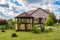 Country house with tiled roof and chimney. Architecture of countryside