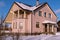 Country house with tiled roof and chimney in countryside. Architecture at the countryside. Winter landscape