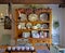 Country Kitchen with Large Open Oak Hutch Filled with White Dishes