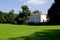 Country manor with lawn in summer