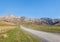 Country road across barren hills in Southern Alps around Molesworth Station, New Zealand