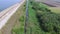 Country road along the grassy river