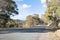 Country road being divided by landscape slope