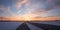 Country road and bikeway beside, sunset winter landscape upper bavaria