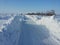 a country road cleared of snow.