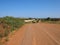 A country road following a freeway