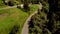 Country road, forest and alpine house.