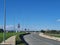 A country road with a lot of traffic signs and light pylons in Athienou Cyprus