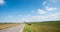 Country road in rural bavarian landscape. blue sky with clouds