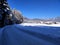 Country road in rural picturesque winter wonderland scenery