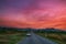 Country Road to Door of Cemetery with Colorful Mor