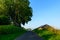 A country road in the traditional French village of Saint Sylvain in Europe, France, Normandy, Seine Maritime, in summer on a