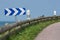 Country road with traffic sign near coast of Normandy, France