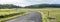 country road in very green jura countryside in france