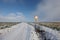 Country road in winter. Text on the sign in German - Agricultural traffic free