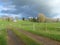 Country scene showing farm track to a Normany Farmhouse