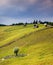 Country scene with wooden huts on the hill and sky rain