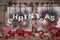 Country style christmas decoration in red, white and wood on an