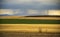 Country thunderstorm, field yellow and green