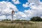 Country Wind pump and cloudy sky