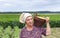 Country woman with basket with yellow bean