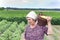 Country woman with basket with yellow bean