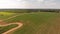 Countryside with dirt road and fields. Aerial view. Summer landscape.