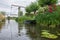 Countryside Dutch canal with bridge and rowing boat