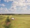 Countryside with fields ,old barn and small pond. Aerial view