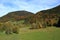 The countryside at the foot of high mountains.