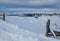 Countryside hills, groves and farmlands in winter remote alpine mountain village