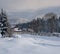 Countryside hills, groves and farmlands in winter remote alpine mountain village