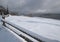 Countryside hills, groves and farmlands in winter remote alpine mountain village