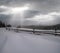 Countryside hills, groves and farmlands in winter remote alpine mountain village