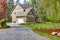 Countryside house exterior. View of entrance and gravel driveway