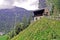 Countryside house, mountain, green field, footpath in Switzerland