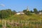 Countryside landscape with abandoned aged Orthodox Church on the hill in Russia hinterland.