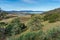 Countryside landscape with farmland with vineyard, lake and mountains