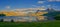 Countryside landscape in Nordland, Bodo, Norway with.glistening waters on a lake near a majestic mountainscape during