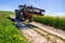 countryside landscape with a tractor with a pitchfork to handle the spreading tractor and its fork in the middle of country lanes