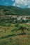 Countryside landscape with white houses next to hill