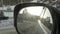 Countryside and mountain landscape reflection in car rearview mirror. Slow motion