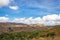 Countryside mountainous landscape with bright blue sky at morning from flat angle