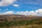 Countryside mountainous landscape with bright blue sky at morning from flat angle