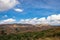 Countryside mountainous landscape with bright blue sky at morning from flat angle