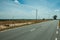 Countryside paved road and electric poles