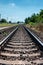 Countryside railroad track in station with platform