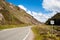 Countryside road in the highlands with a passing place sign