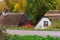 A countryside road with old typical dutch cottages with thatched rooftops