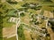 countryside roads and fields with small village. aerial view